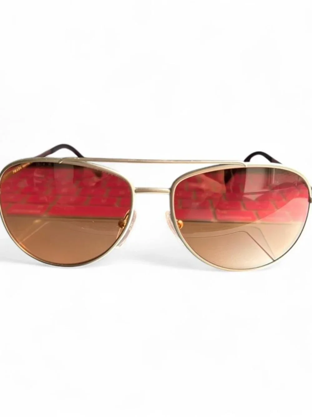 Prada Linea Rossa PS 55US aviator sunglasses, matte silver frame orange lens
